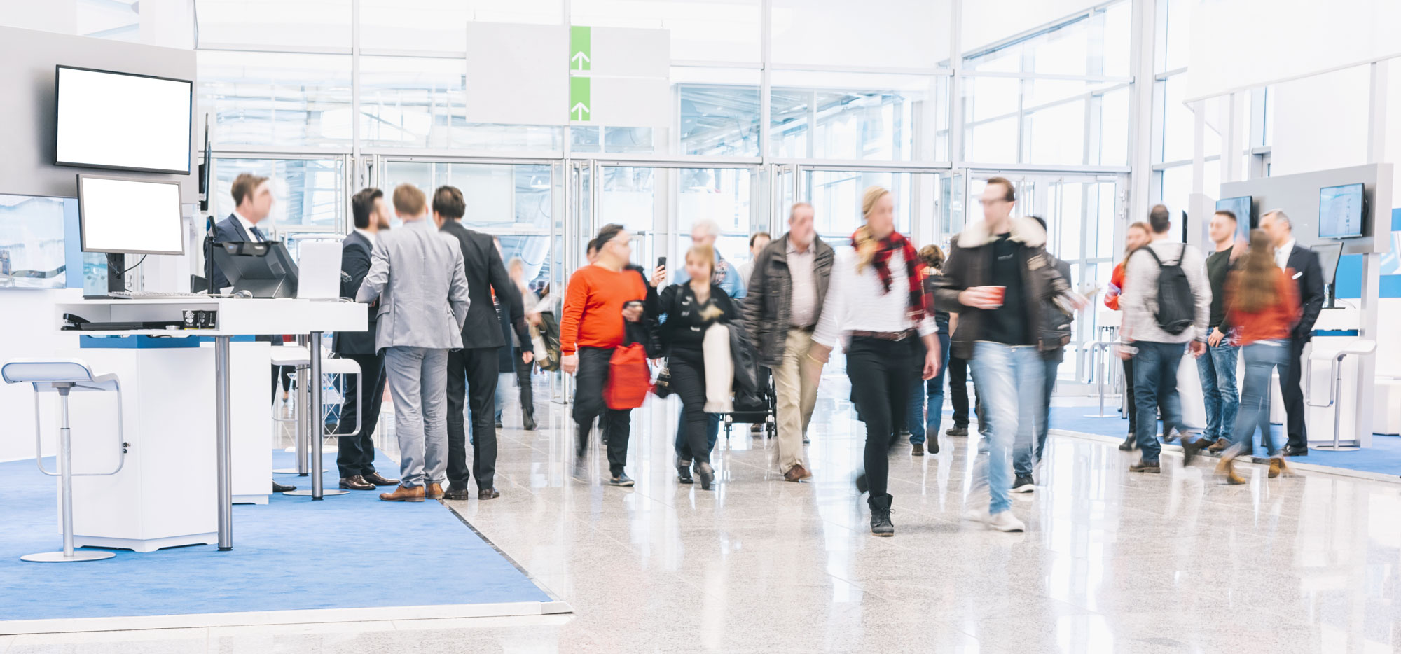 People walking through conference hall